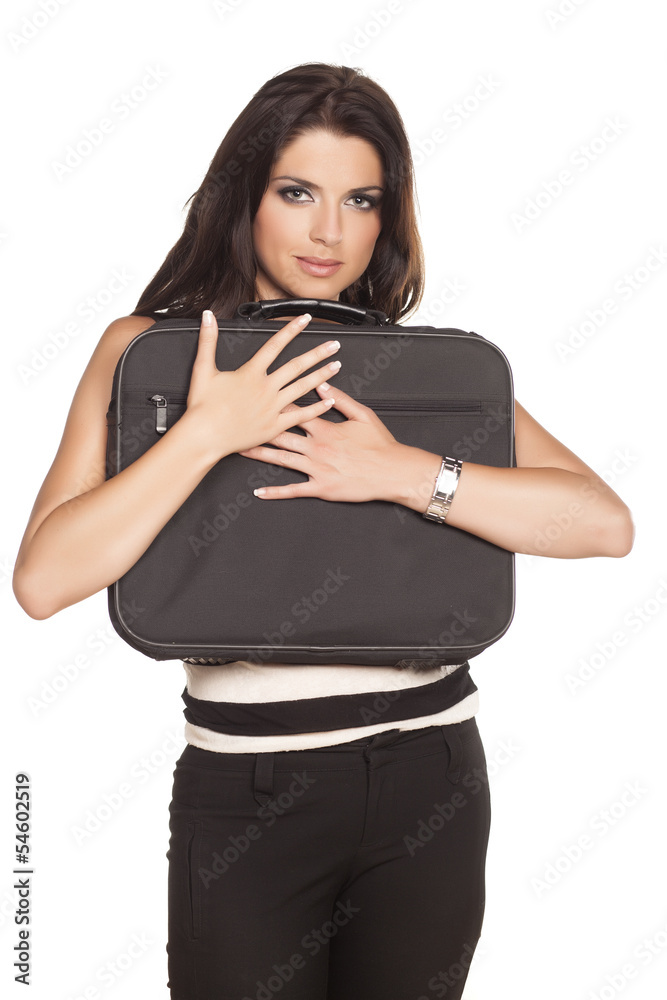 Fototapeta premium Beautiful young business woman hugging her laptop bag
