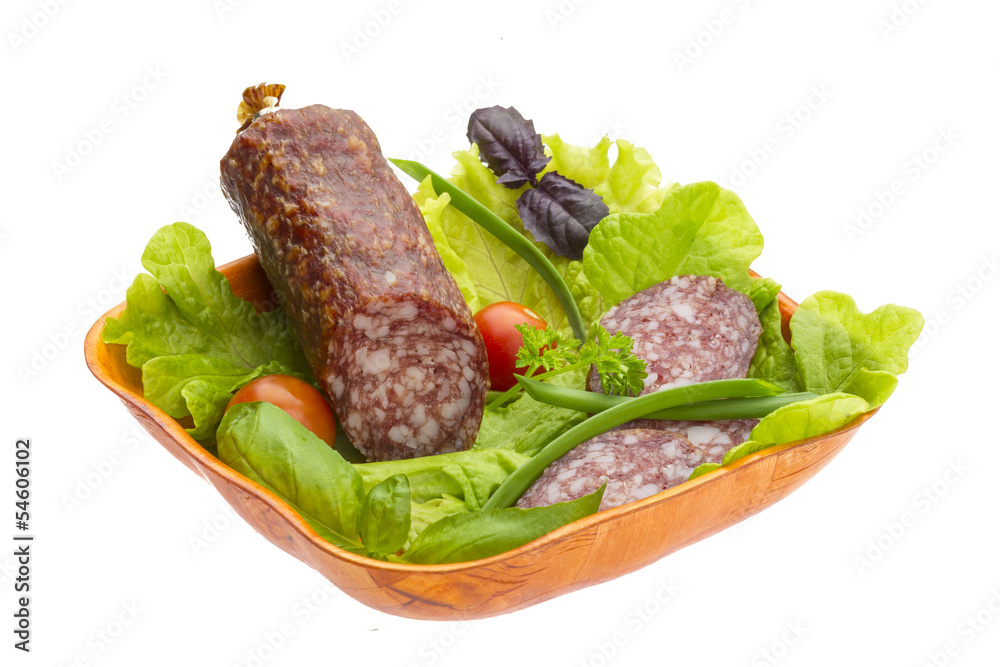 Ripe salami with salad, basil, onion and tomato Ripe salami with salad, basil, onion and tomato