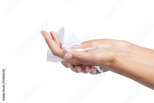 Woman cleaning her hands with a tissue
