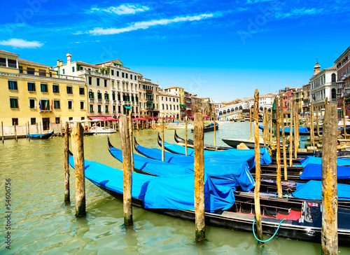 Venice grand canal  gondolas or gondole and Rialto bridge. Italy