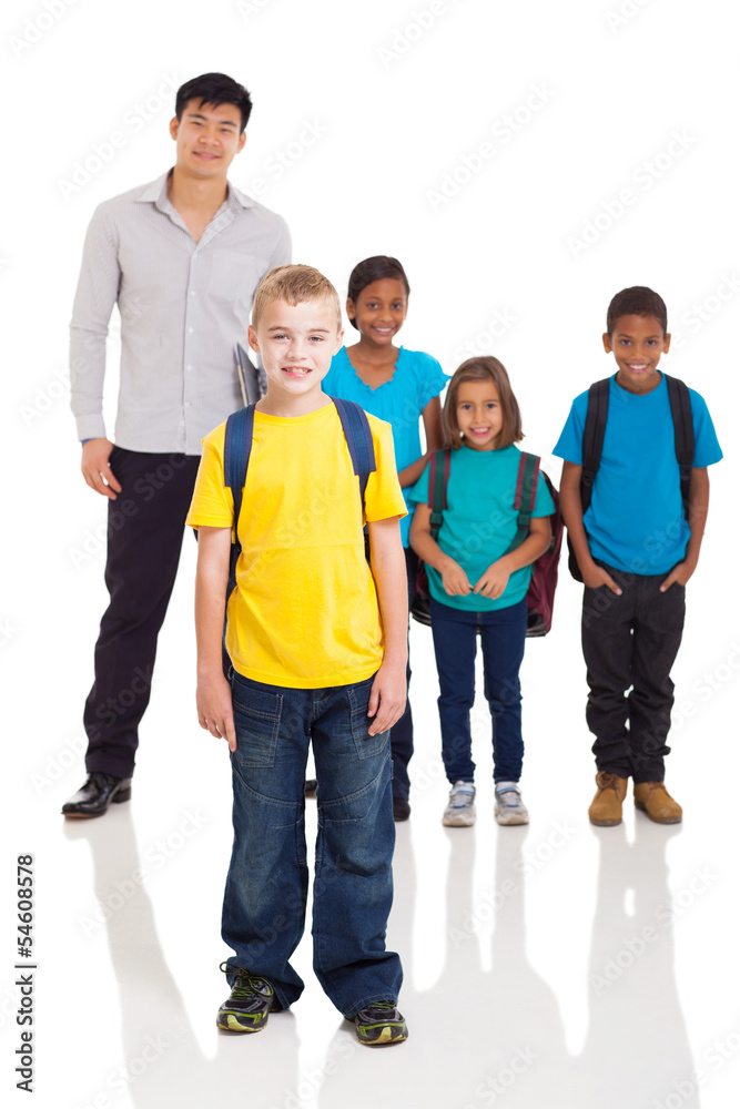 boy standing in front of classmates and teacher boy standing in front of classmates and teacher