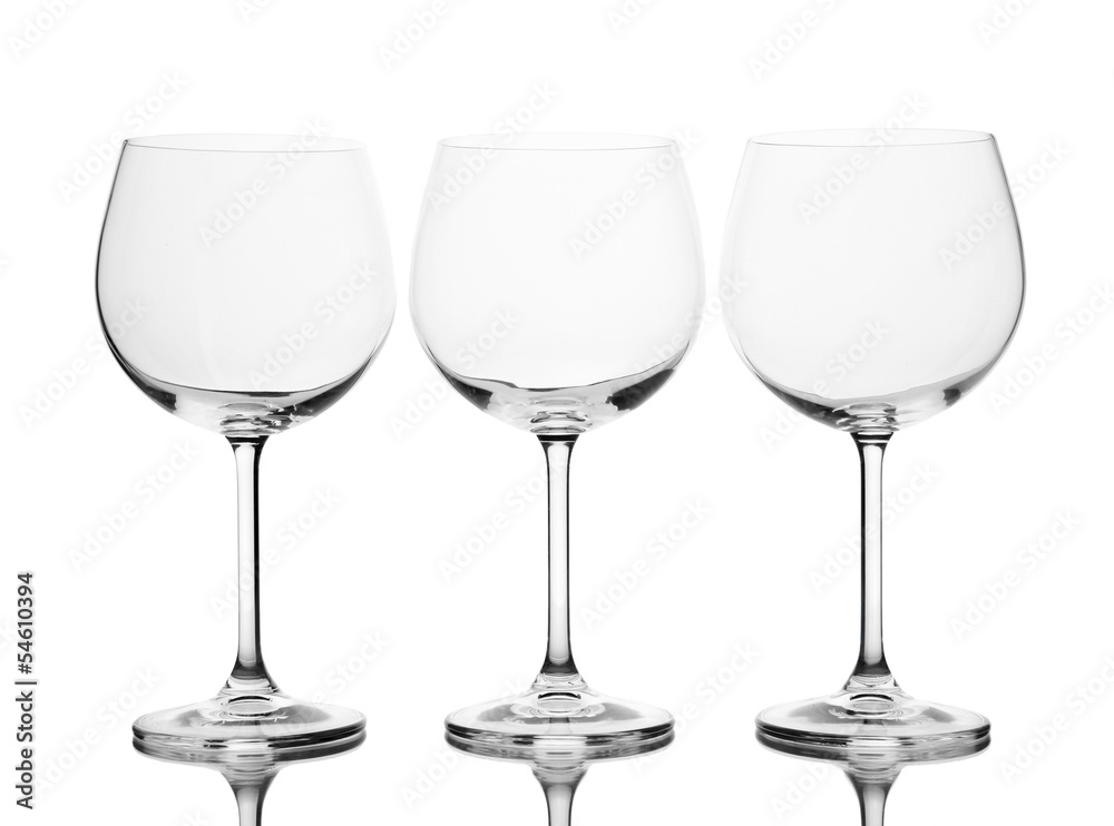 Empty wine glasses arranged and isolated on white