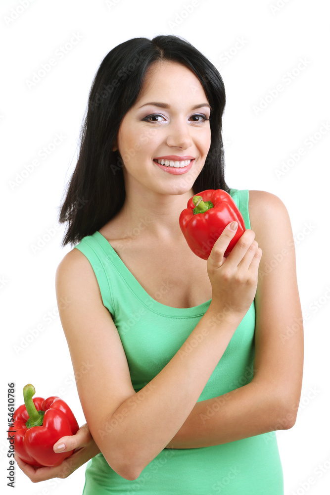 Girl with fresh peppers isolated on white