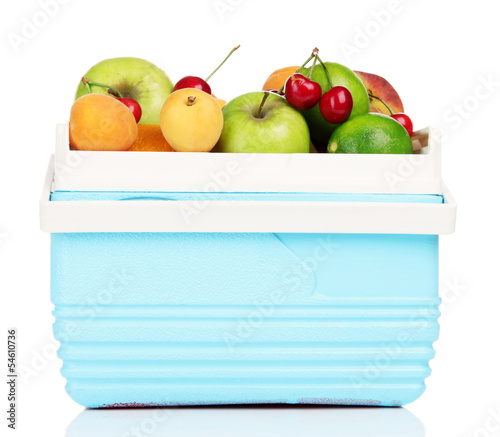 Fresh fruits in mini refrigerator, isolated on white