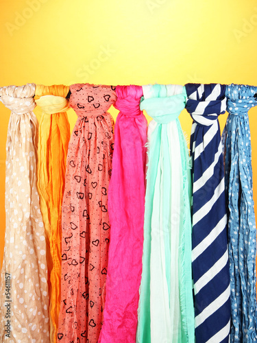 Colored scarves on orange background © Africa Studio