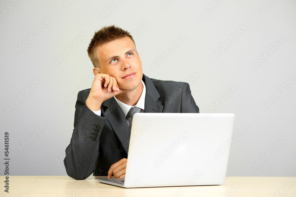 Portrait of young businessman working in office Portrait of young businessman working in office