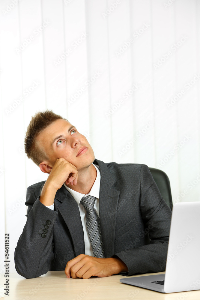 Portrait of young businessman in office Portrait of young businessman in office