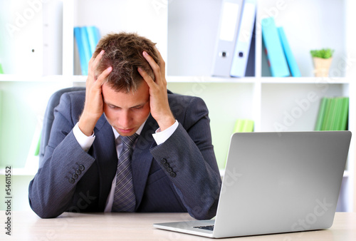 Portrait of young businessman working in office