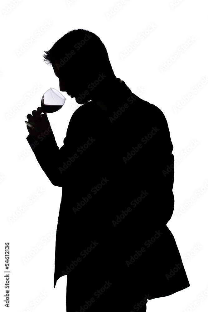 man smelling the aroma of fine red wine man smelling the aroma of fine red wine