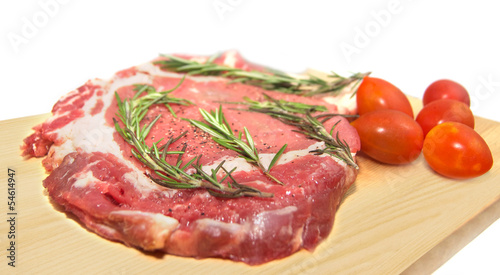 Fresh raw beef with herbs and tomatoes