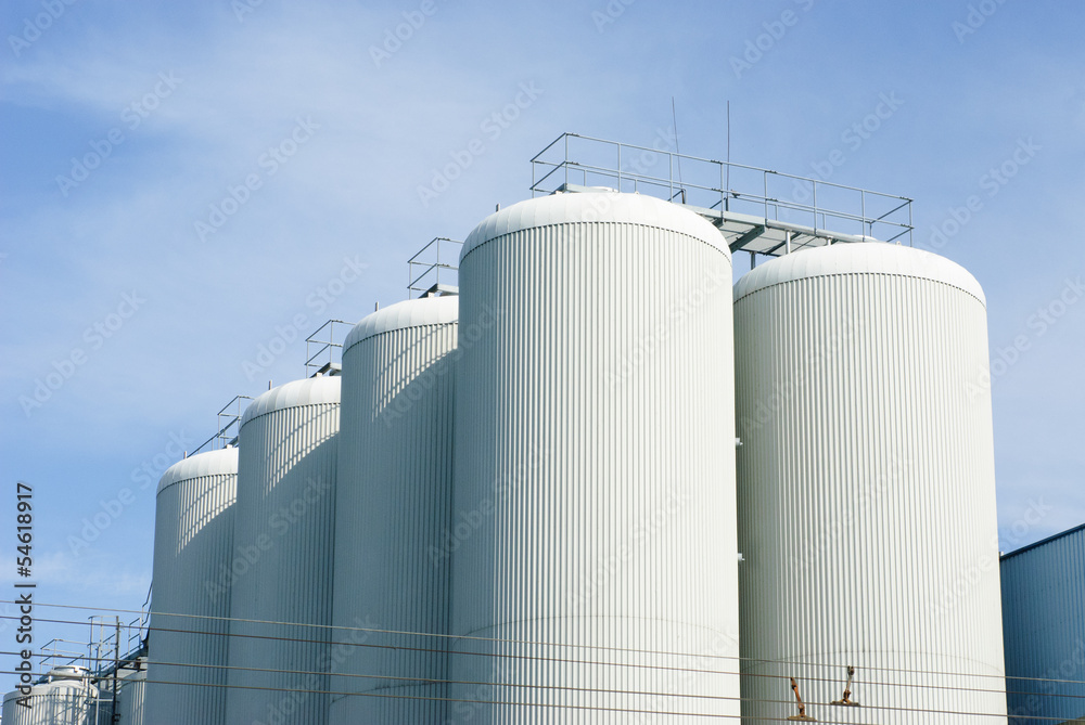 brewery tanks blue sky big containers beer production industry