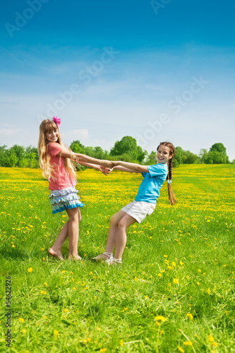 Girls dancing in the flower field