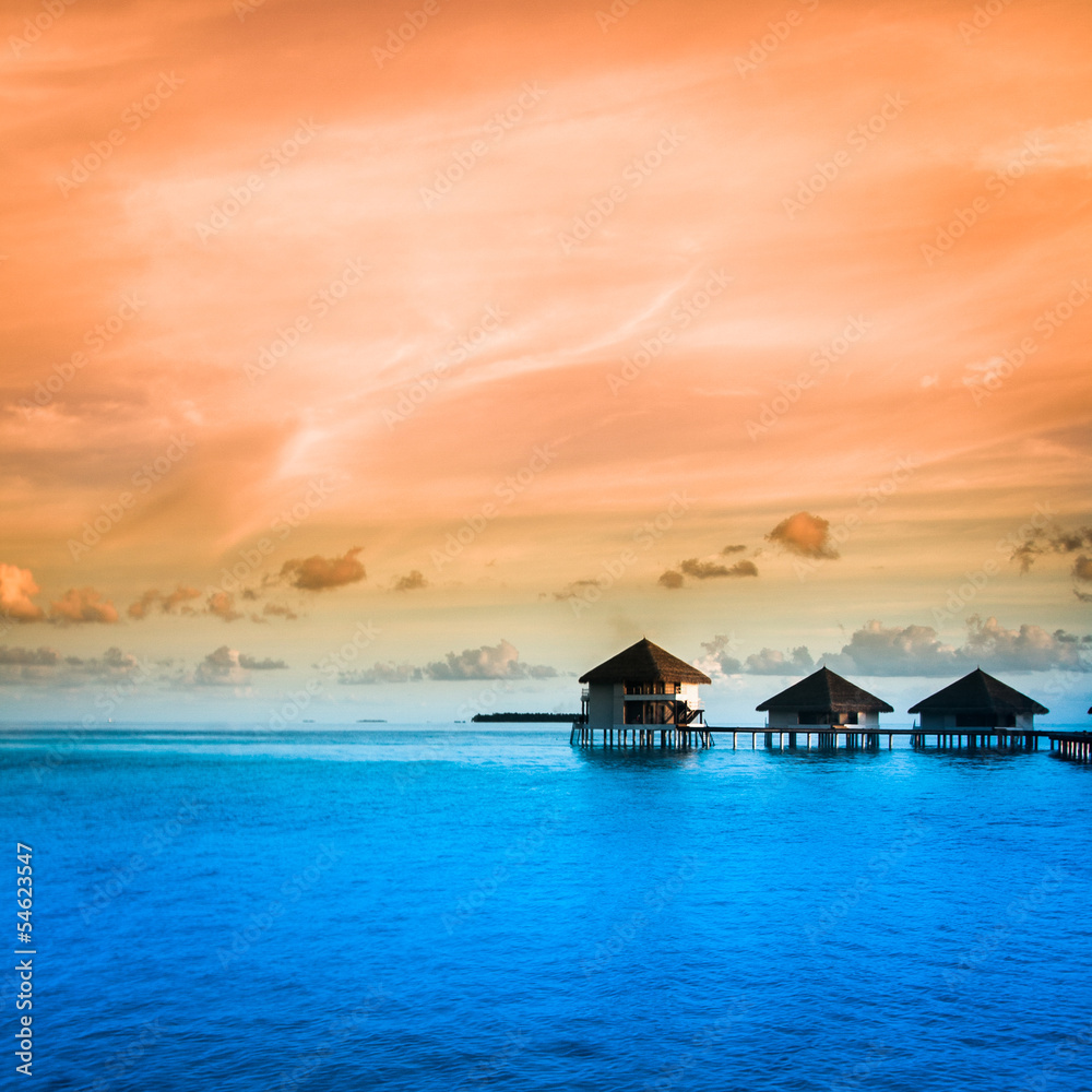 Over water bungalows with steps into amazing green lagoon