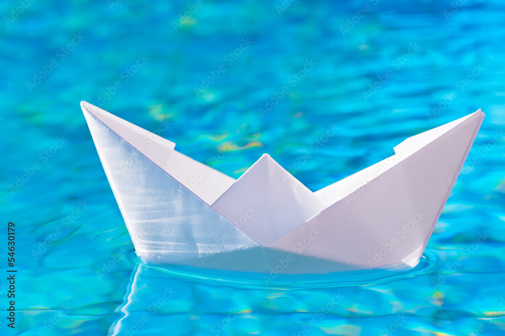 paper boat on the water in the pool paper boat on the water in the pool