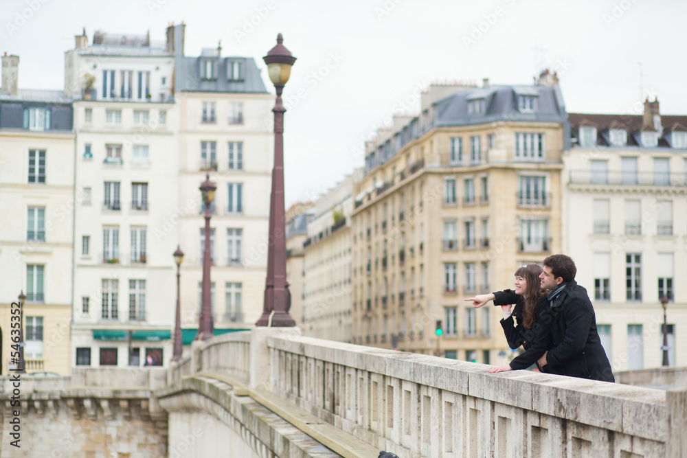 Fototapeta premium Happy couple laughing on the bridge