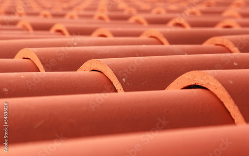 Red tile roof closeup photo with selective focus