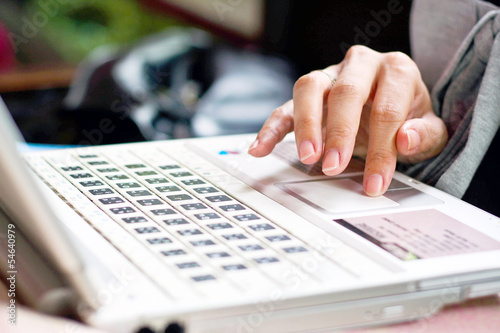 fingers and white computer