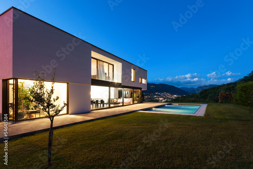 Modern villa with pool, night scene © alexandre zveiger