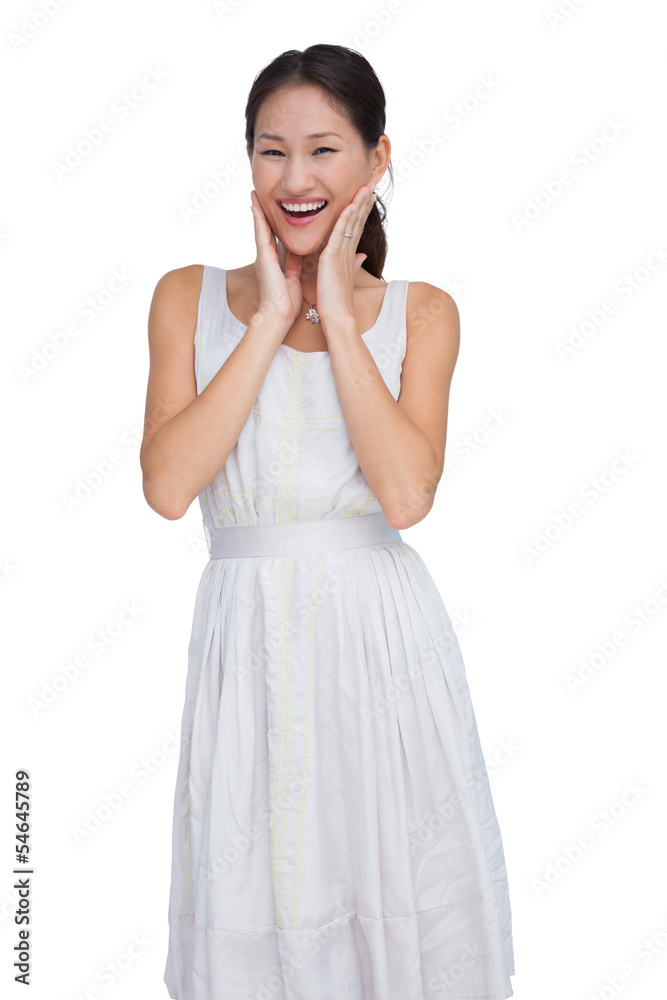 Smiling woman with hands on her face Smiling woman with hands on her face