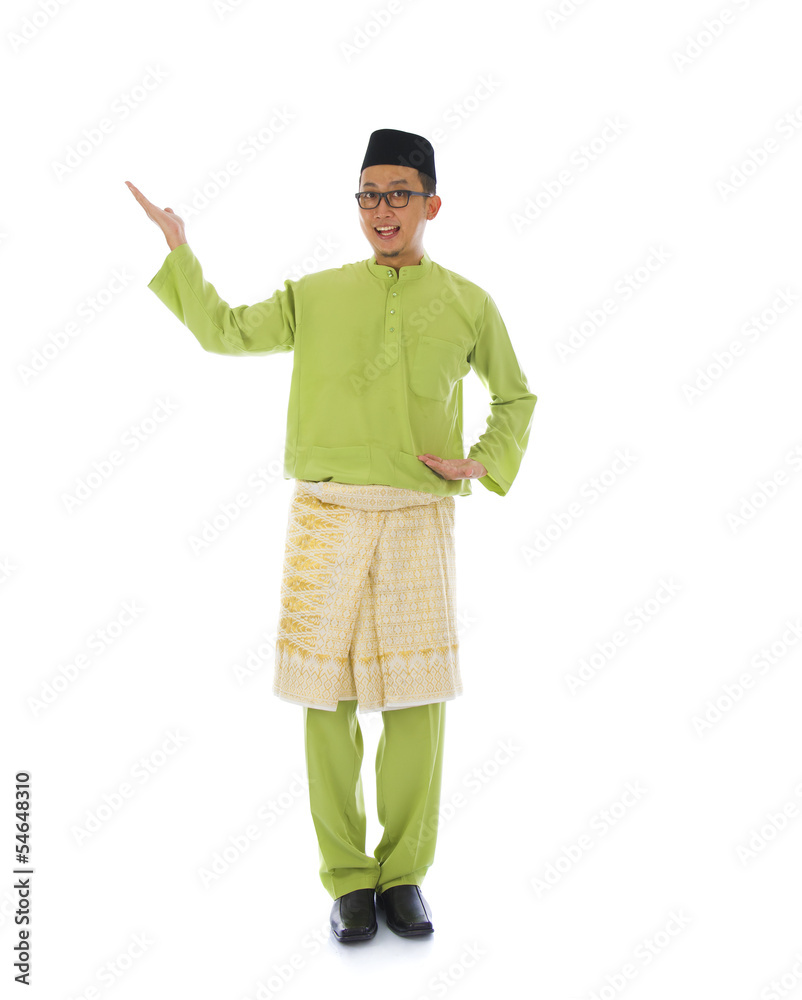 Traditonal Malay man with welcome gesture during ramadan isolate Traditonal Malay man with welcome gesture during ramadan isolate