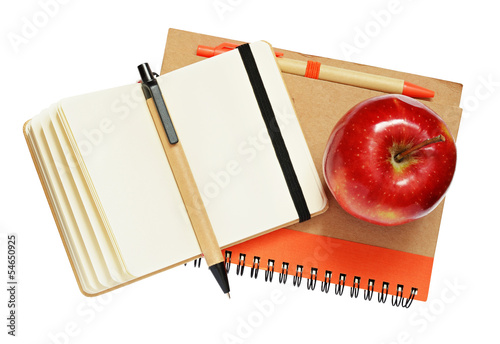 Notebooks, pens and apple
