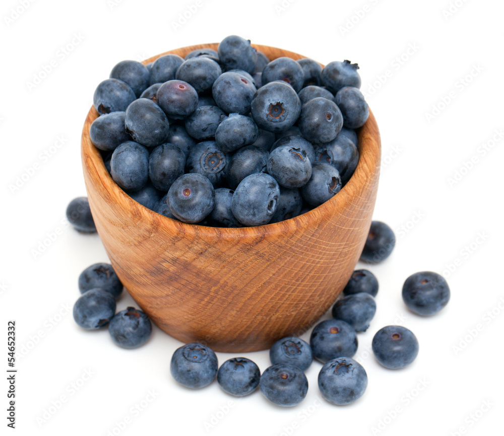 blueberries in a wooden bowl blueberries in a wooden bowl