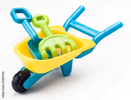 shovel rake and wheelbarrow toy on white base