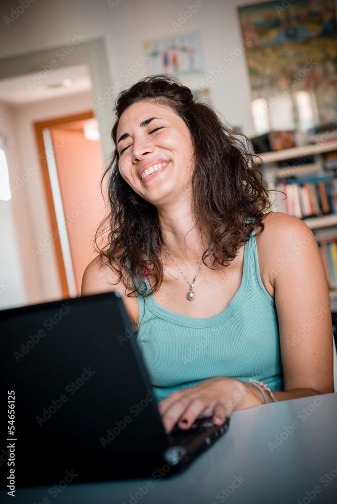 young woman using notebook at home young woman using notebook at home