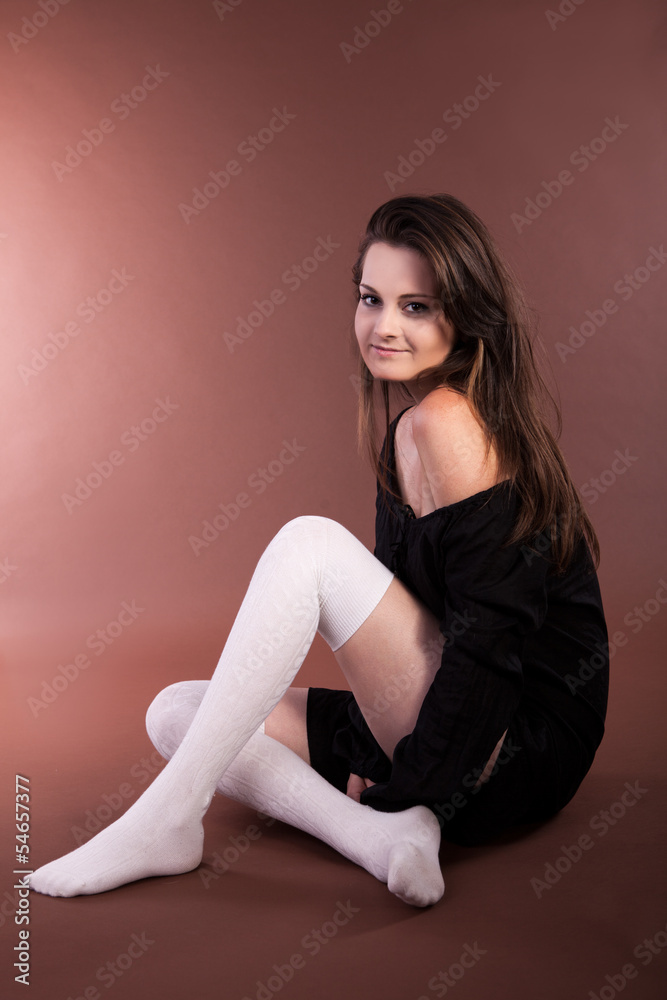 Beautiful girl on brown background studio shot Beautiful girl on brown background studio shot