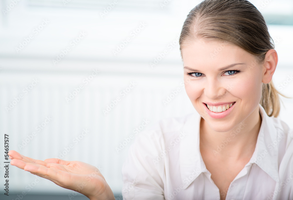 Business woman pointing, presenting a copyspace in the office. Business woman pointing, presenting a copyspace in the office.