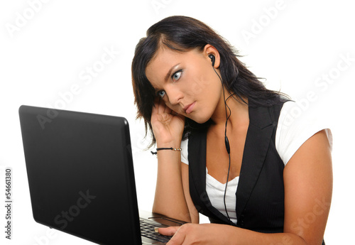 Young woman with laptop and earphones.