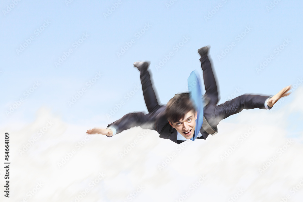 Young businessman flying with parachute on back Young businessman flying with parachute on back