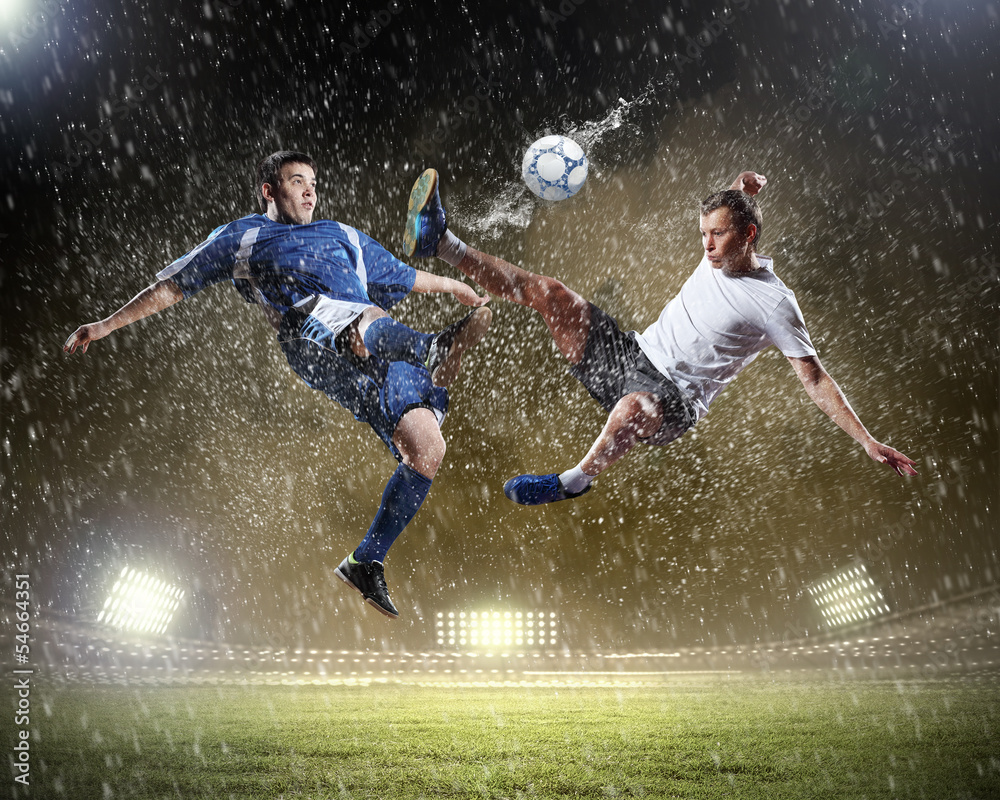 Naklejka premium two football players striking the ball