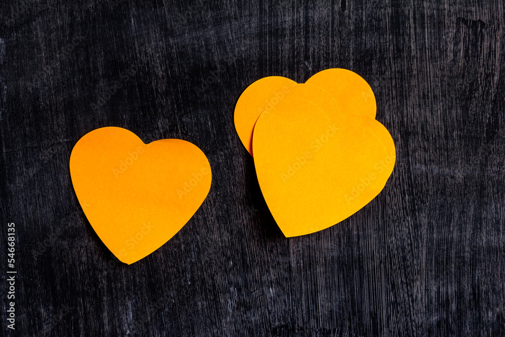 Obraz premium Heart shaped notes on blackboard