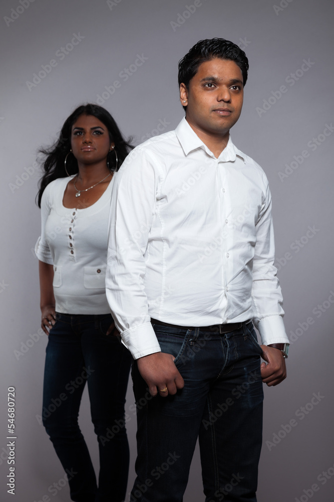 Young romantic indian couple. Wearing white shirt and jeans. Stu Young romantic indian couple. Wearing white shirt and jeans. Stu