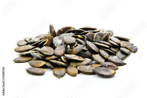 Pumpkin seeds on a white background