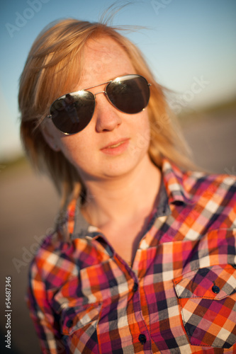 portrait of freckled blonde outside
