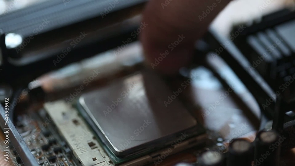 Inserting a CPU into a motherboard socket Inserting a CPU into a motherboard socket