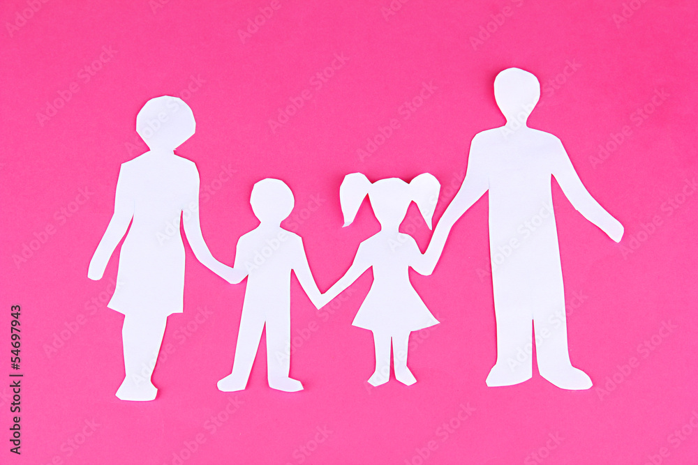 Family from paper on bright background Family from paper on bright background