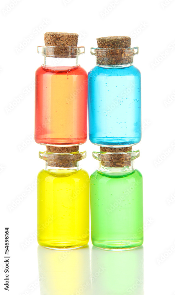 Bottles with colored liquids isolated on white Bottles with colored liquids isolated on white