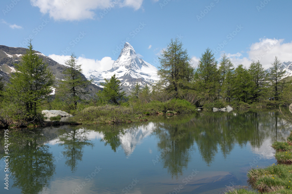 Matterhorn reflected in Grindjisee lake in Swiss Alps