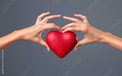 red heart in hands