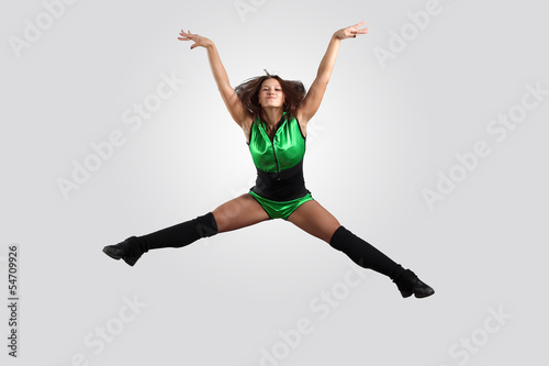 Young female dancer against white background