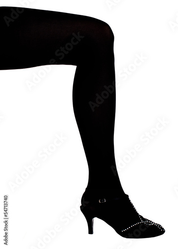 Woman leg in black tights and glittery everning shoe