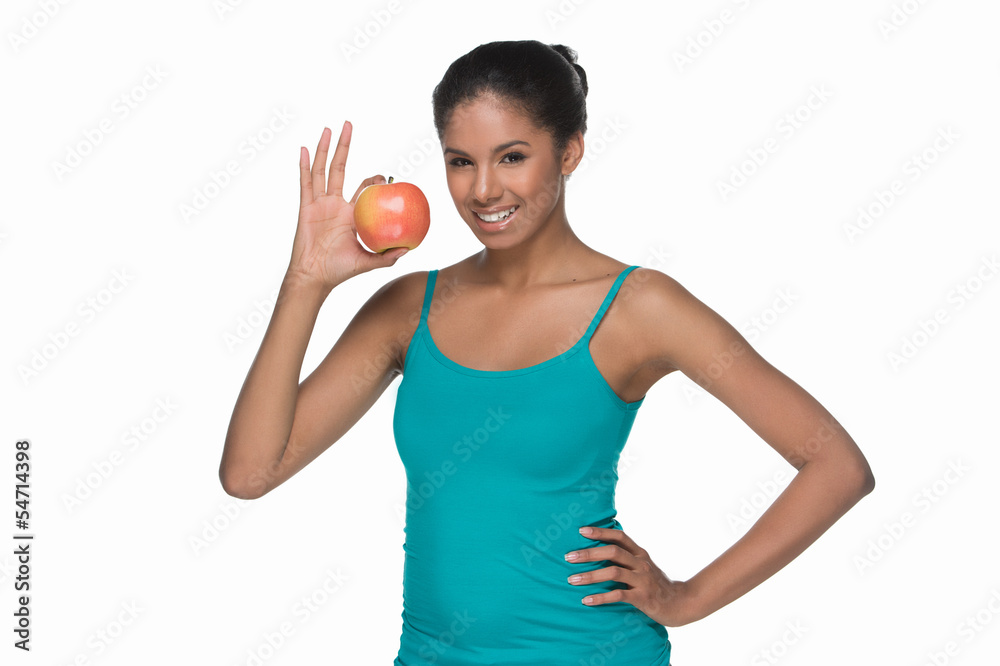 Women with apple. Beautiful young women holding an apple while s Women with apple. Beautiful young women holding an apple while s