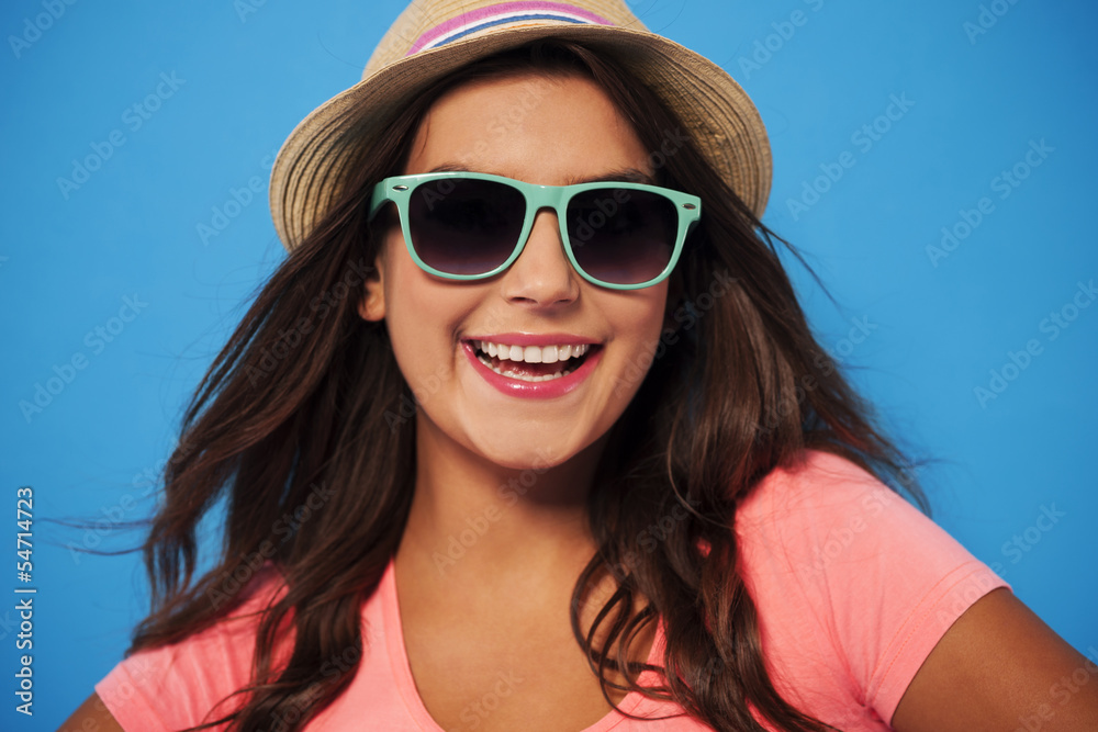 Summer woman wearing sunglasses and straw hat