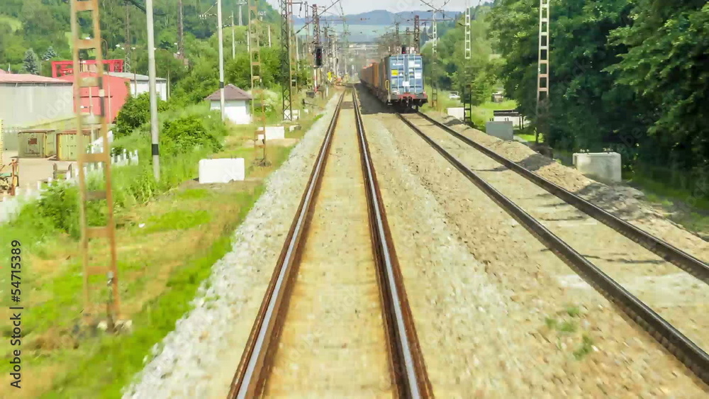 Train moving through green grassed countryside , moving railroad Train moving through green grassed countryside , moving railroad