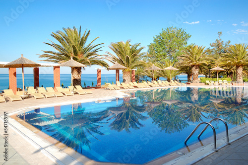 Swimming pool by a beach at the modern luxury hotel, Thassos isl © slava296