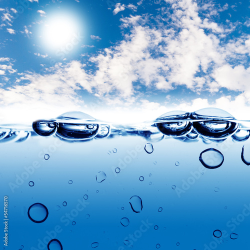 Water wave and water bubble with blue sky background