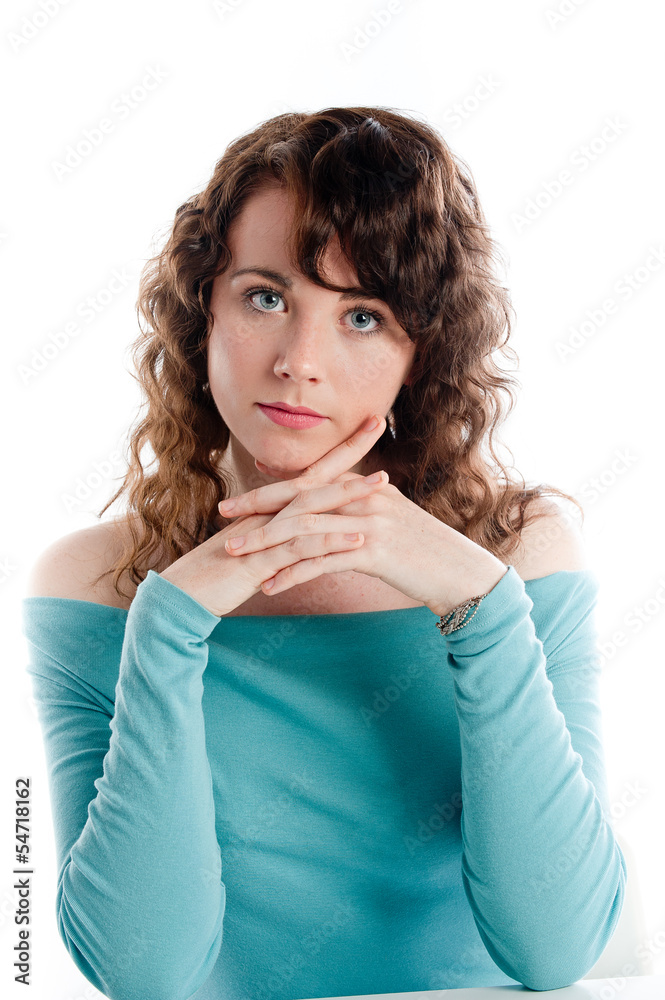 Gorgeous brunette in a turquoise dress posing in the studio Gorgeous brunette in a turquoise dress posing in the studio